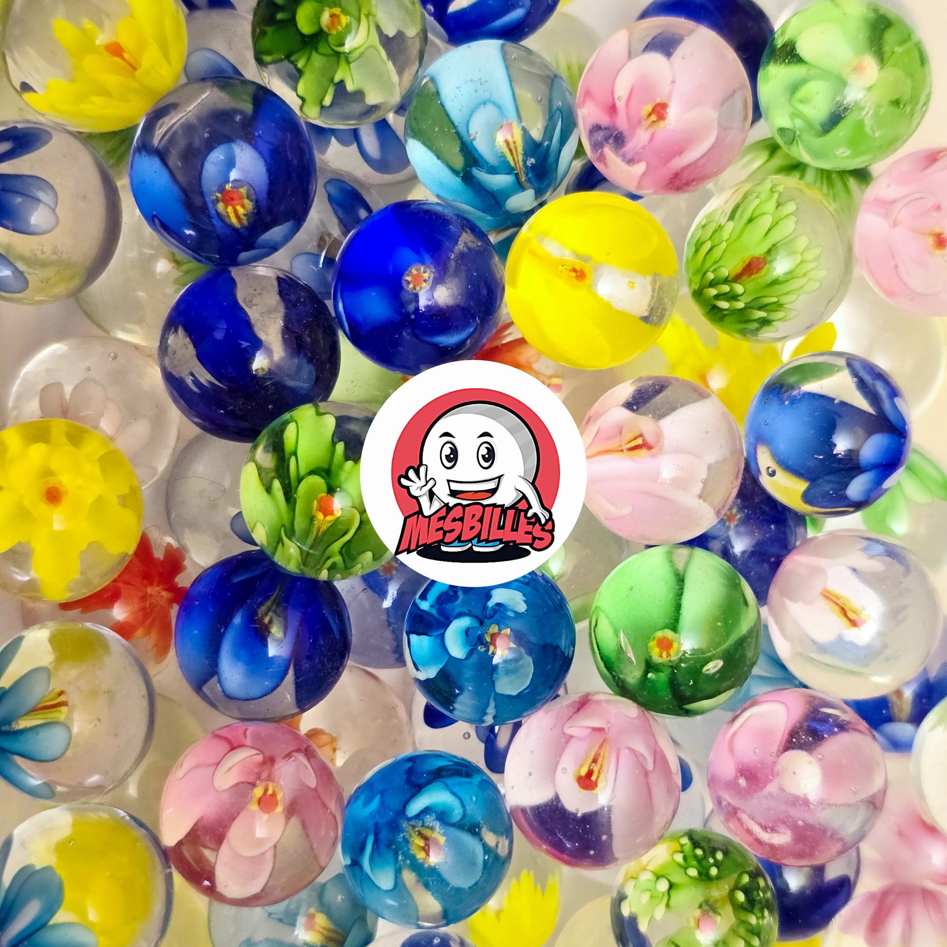 Collection de billes en verre décorées de fleurs colorées dont la bille Art Pissenlit Rose 16 mm – MesBilles